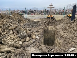 Freshly dug graves appear in the cemetery almost every day.