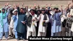 Volunteers of Pen Path led by Matiullah Wesa (holding a megaphone) during a March 25 protest for education for all.