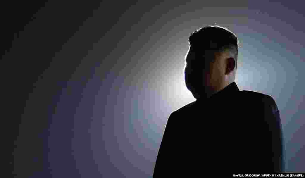 North Korean leader Kim Jong Un waits for the arrival of Russian President Vladimir Putin at the airport in Pyongyang on June 18. The Russian president's two-day visit to the secretive one-party state is being closely watched for signs of a new strategic alliance as Moscow seeks to bolster its supply of munitions and ballistic missiles for use on the Ukrainian battlefield.  