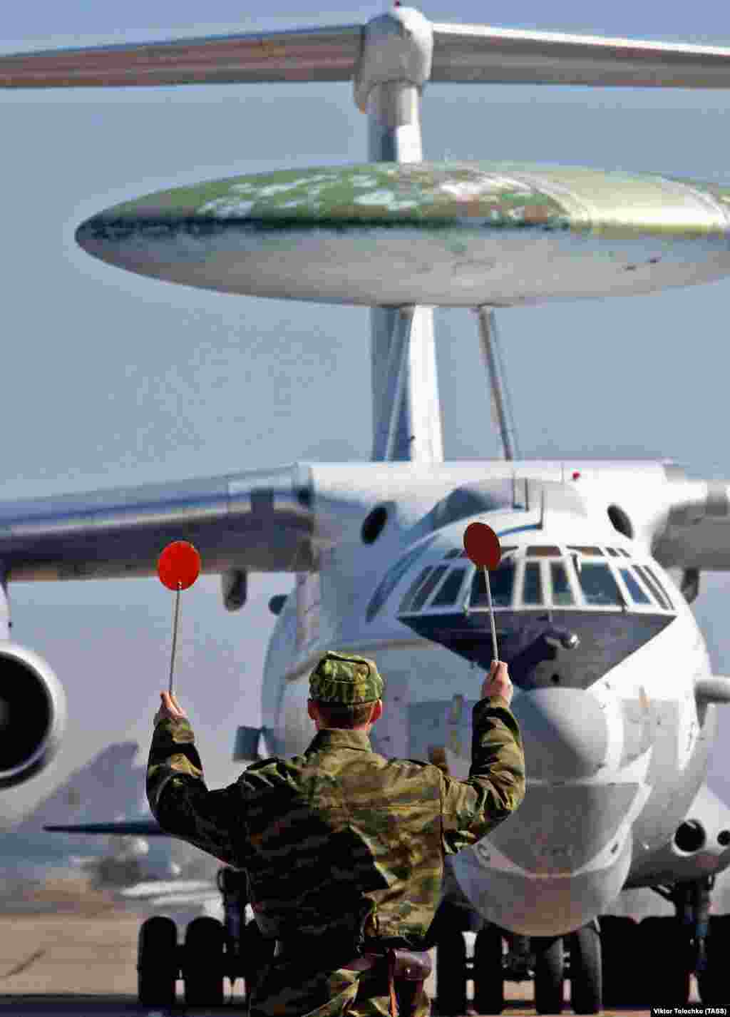 A Russian A-50 at a Belarusian airfield in 2005.  The plane's radar system is housed in a nearly 10-meter wide “rotodome,” which rotates at around the speed of a slushie machine. The plane is fitted with a gold layer on its windows to protect its flight crew from the high doses of radiation being pumped out from its radar dish.     