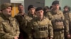 Депутат чеченского парламента Магомед Ханбиев (в центре) вместе с бойцами на оккупированных территориях Украины. Скриншот из видео, опубликованного 23 апреля 2024 года в официальном телеграм-канале главы Чечни Рамзана Кадырова