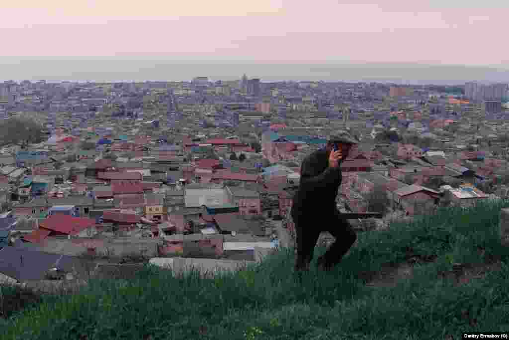 A man climbs a hill overlooking Derbent. After the October 29 airport violence, Rabbi Isakov told a local media outlet, “The situation is very difficult in Daghestan, the community is very afraid,” and added, “It’s not clear where to flee to."  