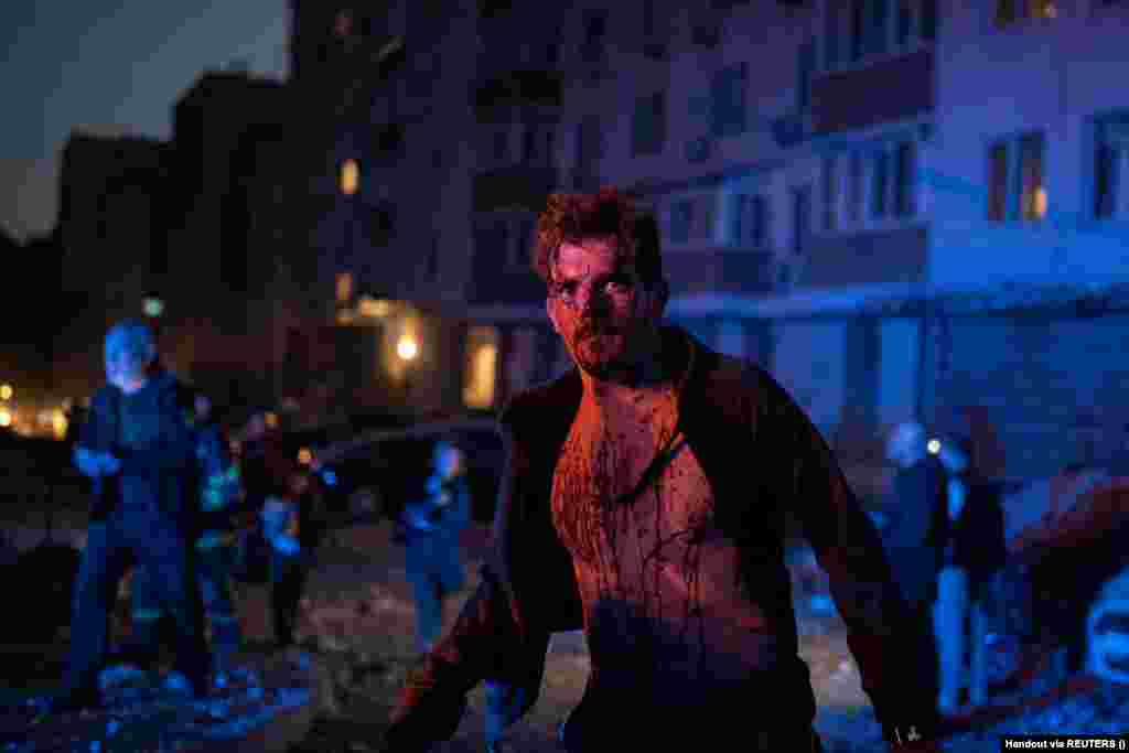 An injured man stands next to an apartment building that was damaged during the massive Russian drone strike on Kyiv. "One person died. In total, four victims were hospitalized in the Holosiyivskiy district. Medics provided help on the spot," Klitschko wrote, adding that 20 people were evacuated.