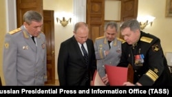 Валерий Герасимов, Владимир Путин, Сергей Шойгу и Игорь Костюков (слева направо)