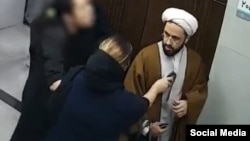 The video in question shows a woman without the mandatory hijab holding her baby, leading to widespread public and online outrage.