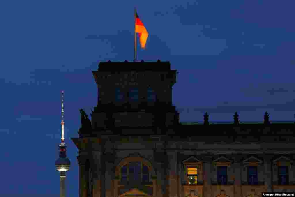A corner of Berlin's Reichstag at dusk.  Germany relies heavily on Russia for its energy needs. Before the Kremlin's February 24 invasion of Ukraine, 55 percent of Germany's gas was purchased from Russia. 