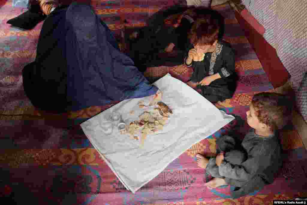 Zarmina, a widow, has two children. She lives in the southern city of Lashkar Gah. She and her children eat bread and drink water for lunch. In March, the World Food Program said that almost 100 percent of female-headed households are facing "insufficient food consumption." Households headed by women are the most vulnerable group among the nearly 9 million Afghans, and the WFP warns they are at risk of "famine-like" conditions.