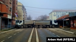 Trucks block a road in the northern city of Mitrovica on December 27.