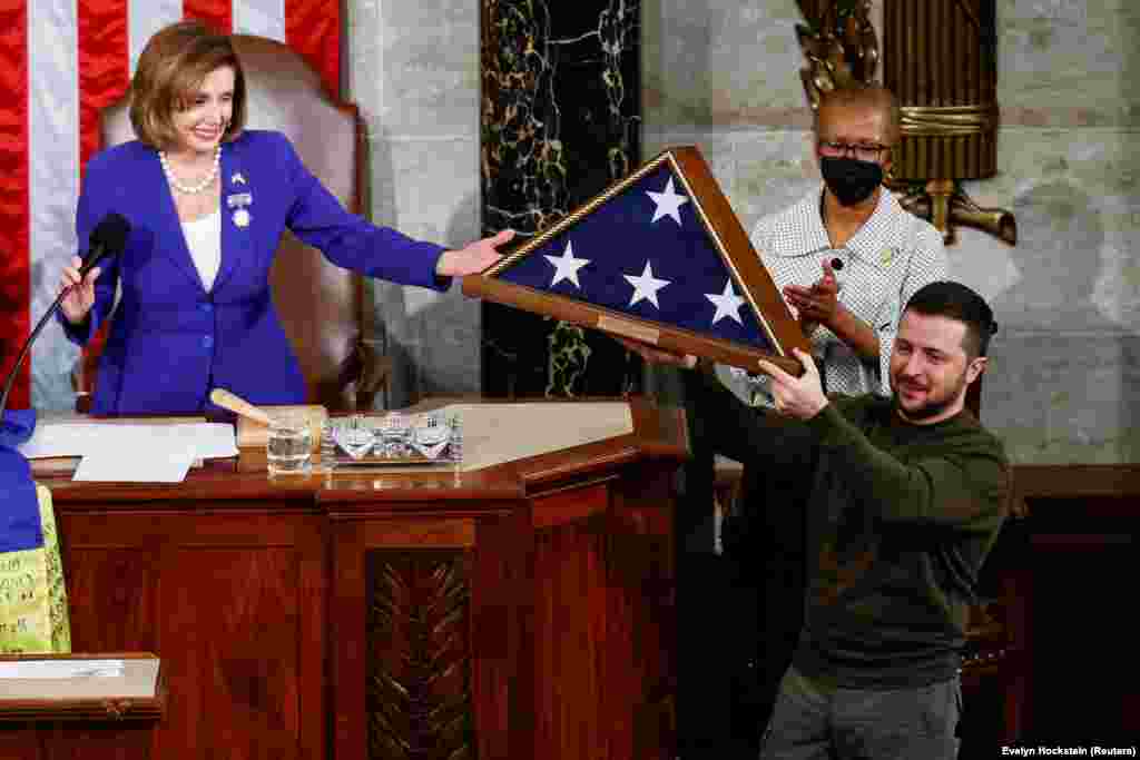 A U.S. flag that had flown over the Capitol building earlier in the day in his honor is presented to Zelenskiy by Pelosi. Zelenskiy concluded his speech with: "Thank you so much, may God protect our brave troops and citizens, may God forever bless the United States of America. Merry Christmas and a happy, victorious New Year. Slava Ukrayini!" (Glory to Ukraine!).