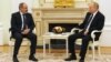 Armenian Prime Minister Nikol Pashinian (left) and Russian President Vladimir Putin in Moscow on April 6. 