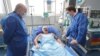 Bulgarian Foreign Minister Nikolay Milkov (left) and his counterpart from North Macedonia, Bujar Osmani (right) visit Hristiyan Pendikov at a hospital in Sofia on January 22.