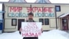 Activist Dmitry Skurikhin staged a single-person picket against the war with Ukraine in St. Petersburg on February 24. His sign reads: Stop, Fascist Bastard, Go Back. The sign in the back says: Peace To Ukraine, Freedom To Russia.