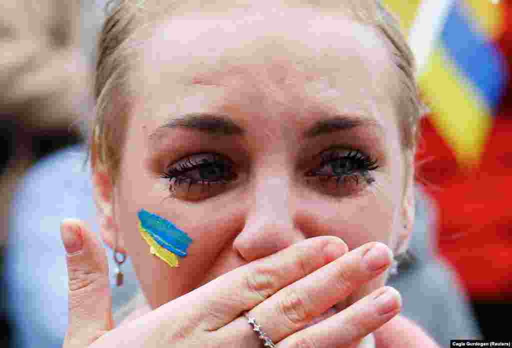 A Ukrainian woman living in Turkey weeps during a protest in Ankara on February 26.