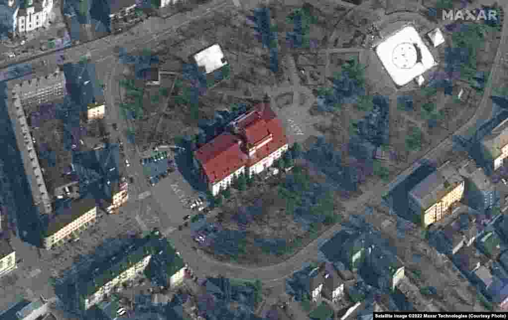 This satellite image taken of the theater on March 14 shows the word “children” written in Russian in large white letters in front of and behind the building.