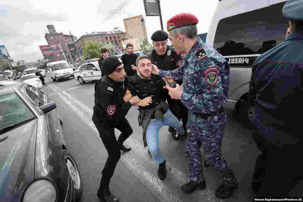 Armenian police forcibly detain a protester in Yerevan on May 4. Ongoing anti-government protests began on May 1 in the Armenian capital over fears that Prime Minister Nikol Pashinian is poised to make major concessions to Azerbaijan over the disputed Nagorno-Karabakh region. 
