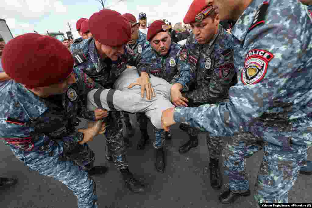 A protester is detained in Yerevan on May 4. Pashinian's Civil Contract party holds 71 of the legislature's 101 seats since snap elections were called in June 2021. 