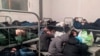Арестованные за участие в митингах в поддержку Алексея Навального в одной из камер миграционного центра в подмосковной деревне Сахарово, 4 февраля 2021 года
