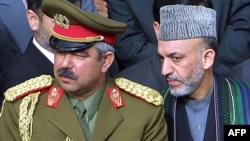 While Afghan President Hamid Karzai (right) may have his own objections, the saber rattling of warlords like General Abdul Rashid Dostum (left, with President Hamid Karzai) could lead to war breaking out again.