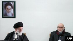 Ayatollah Ali Khamenei (left) is pictured here with a member of Egypt's Muslim Brotherhood. Khamenei says the revolts sweeping the Arab world have a spiritual kinship with Iran's own 1979 revolution.