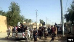 Iraqi Sunni fighters on the streets of Tikrit earlier this month.