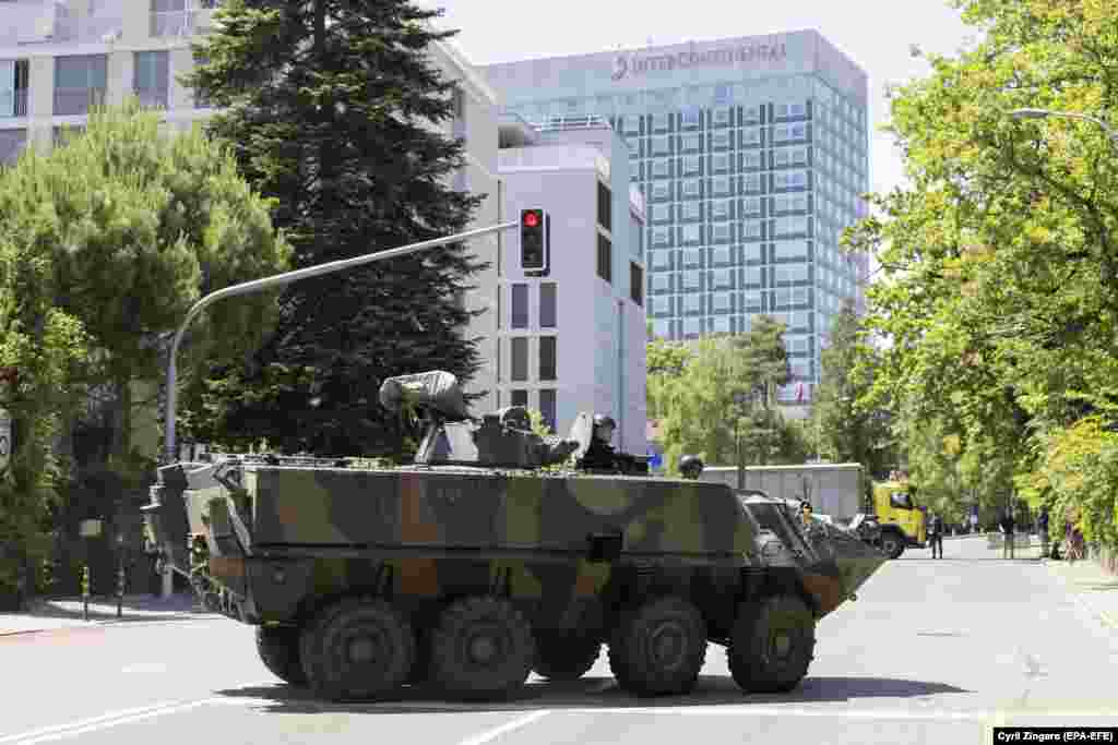 An armored vehicle stands in front of Geneva's InterContinental hotel, where Joe Biden is staying, on June 15. 