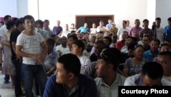 Kazakhs at a courthouse in Aqtau await verdicts in a case concerning riots in the town of Shetpe late last year.