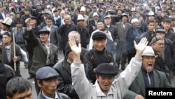 Interim government followers disrupt a rally of Bakiev supporters. Many Kyrgyz feel the police have failed to keep the peace between rival groups.