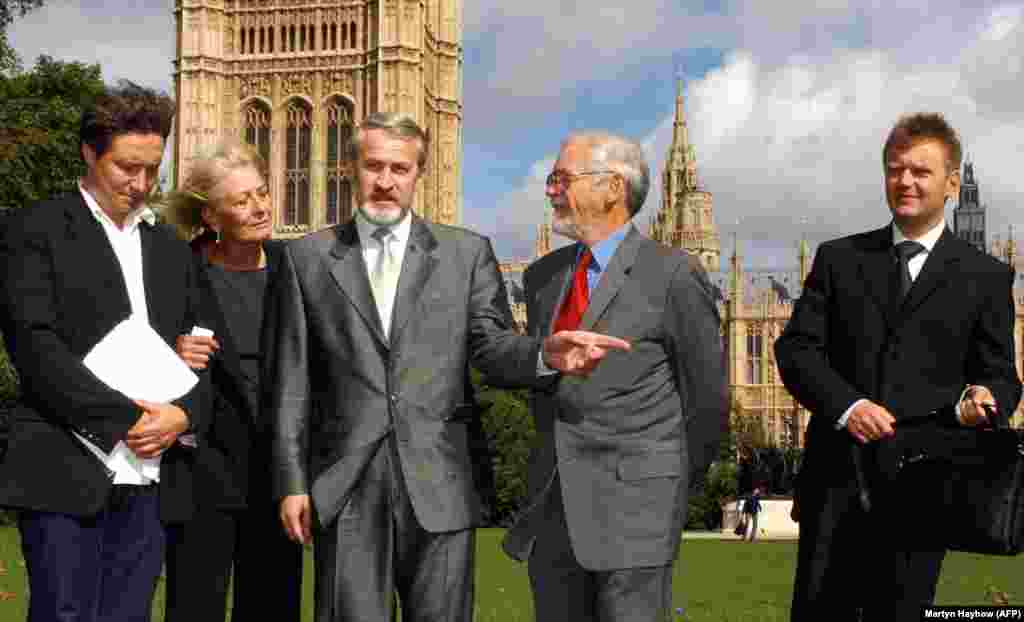 Litvinenko (right) is pictured outside Britain's House of Lords on September 14, 2004, after a press conference calling for international help to resolve the Chechnya conflict. He joined (left to right) filmmaker Andrei Nekrasov; actress and human rights campaigner Vanessa Redgrave; Akhmed Zakayev, a leading Chechen separatist granted asylum in Britain; and Lord Rea, a friend of Litvinenko and director of the Save Chechnya campaign.  