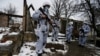 Russia-backed separatists are seen at a frontline position near the contact line with Ukrainian forces in the village of Zholobok in the eastern Luhansk region on March 23.