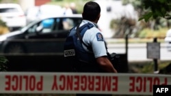 A policeman stands guard Masjid al-Noor mosque after a deadly shooting incident in Christchurch, New Zealand, on March 15.