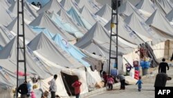 Сирийские беженцы в лагере Каркамис 16 января 2014 года