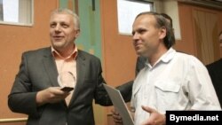 Belarus journalist Henadz Barbarych (right) was briefly detained today by the KGB. He is pictured here in 2007.