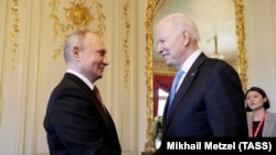 Russian President Vladimir Putin (left) and U.S. President Joe Biden shake hands as they meet for talks in Geneva on June 16.