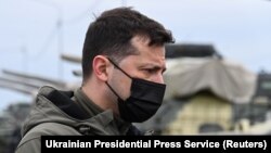Ukrainian President Volodymyr Zelenskiy visits a military fortification on April 27 in an area bordering the Crimean Peninsula, which was forcibly seized by Russia in 2014.