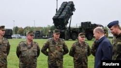 German Chancellor Olaf Scholz meets with members of the Patriot air-defense system unit as he visits the Cologne-Bonn Air Force on October 23.
