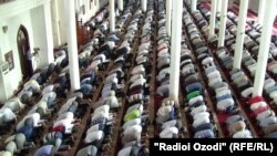 Tajik men pray in a Dushanbe mosque. Women have been forbidden from attending prayers since 2004.