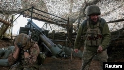 Ukrainian troops fire a self-propelled howitzer toward Russian troops near Pokrovsk earlier this month.