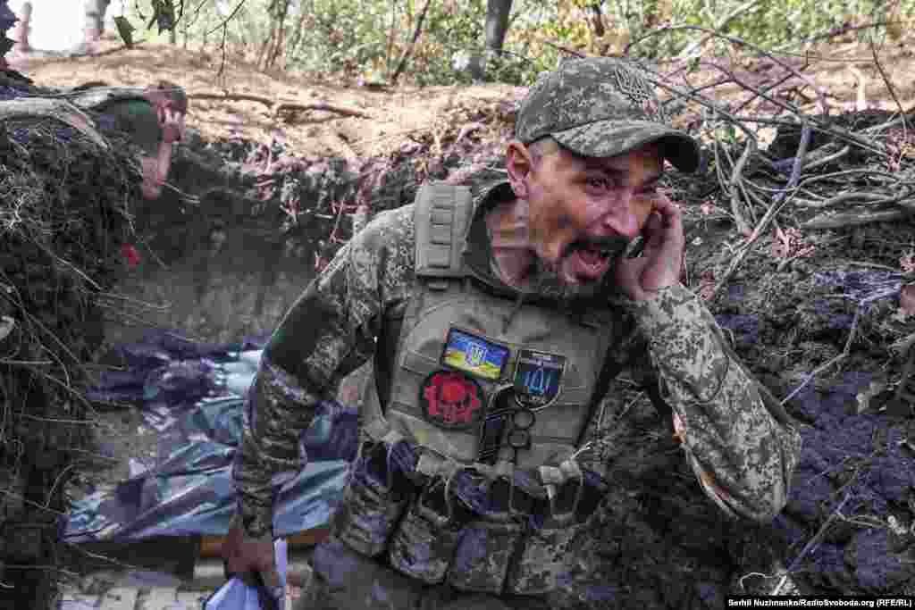 Artem, a 40-year-old Ukrainian commander, shouts a warning before his artillery team fires toward Russian positions near Pokrovsk in early October 2024.  