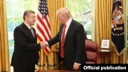 Georgian Prime Minister Giorgi Kvirikashvili (left) meets U.S. President Donald Trump at the White House on May 8.