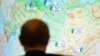 Russia -- Russian President Vladimir Putin looks at Russian map during a live-broadcasted test-launch of the Russia's Angara-A5 new heavy-class rocket from the Plesetsk cosmodrome in the Arkhangelsk region, December 23, 2014