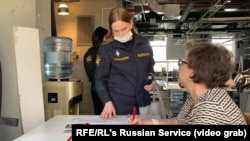 Court bailiffs visited the offices of RFE/RL's Moscow bureau and Current Time on May 25, photographing computers and other editorial equipment they've threatened to seize over unpaid fines imposed under the "foreign agents" law.