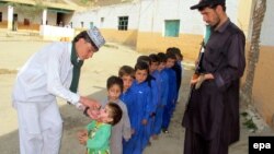 Children are vaccinated against polio during a three-day nationwide campaign to eradicate the disease, in Landikotal, near the Pakistani-Afghan border last month.