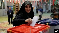 A woman in Tehran casts her ballot on March 1.