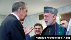 Глава МИД России Сергей Лавров и бывший президент Афганистана Хамид Карзай на торжественном заседании, посвященном 100-летию установления российско-афганских дипломатических отношений, Москва, 28 мая 2019 года