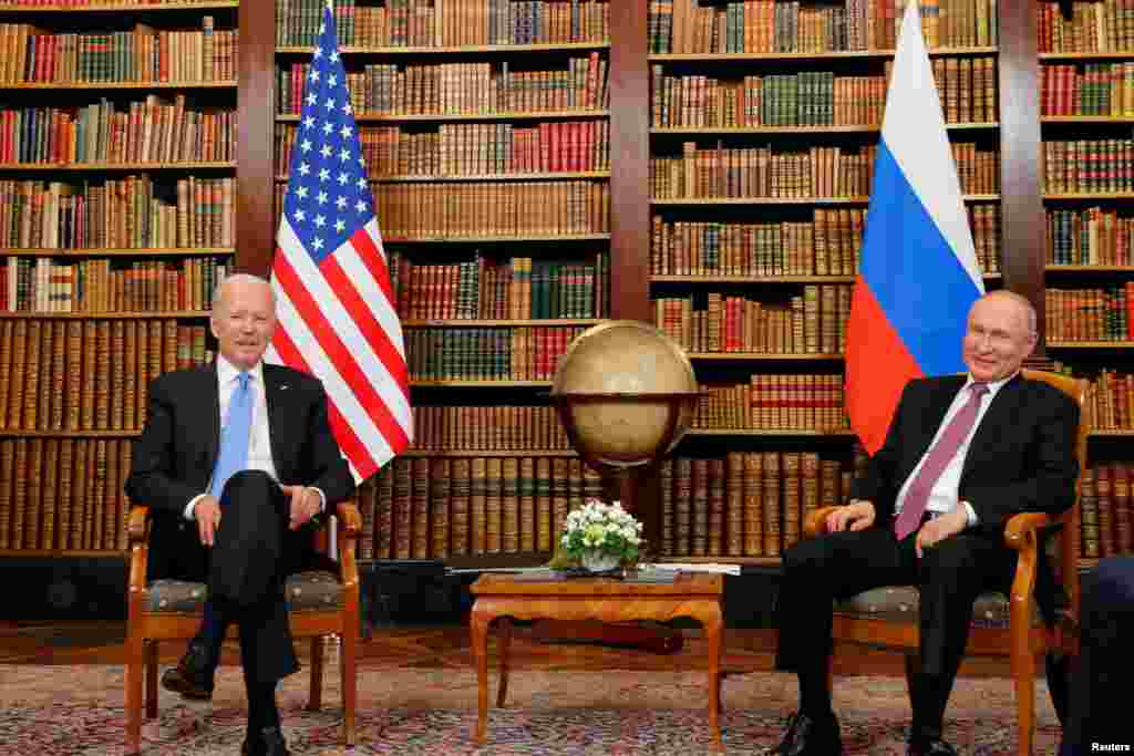 Biden and Putin inside a library in the historic villa. 