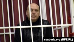 Fashion designer Sasha Varlamau attends the opening court hearing during his trial in Minsk on February 4.