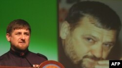 Chechen leader Ramzan Kadyrov in front of a portrait of his father Akhmad Kadyrov, who was assassinated in 2004.