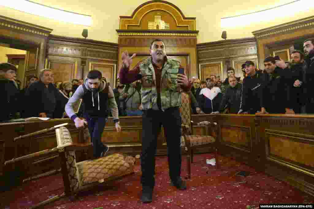 Protesters inside the partially-vandalized government building in central Yerevan. 