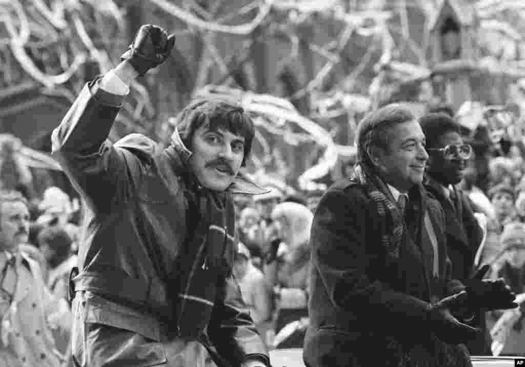 Former hostage Alan Golacinski of Silver Spring, Maryland, waves during a ticker-tape parade in Manhattan that honored the returning Americans on January 30, 1981. The agreement that resulted in the release of the hostages called for the unfreezing of $7.9 billion of Iranian assets abroad. The hostages were blocked from suing Iran, but in 2015, they were granted $4.4 million each by the U.S. government. The money was taken from an $8.9 billion fine against French bank BNP Paribas for its role in the violation of economic sanctions against Iran.