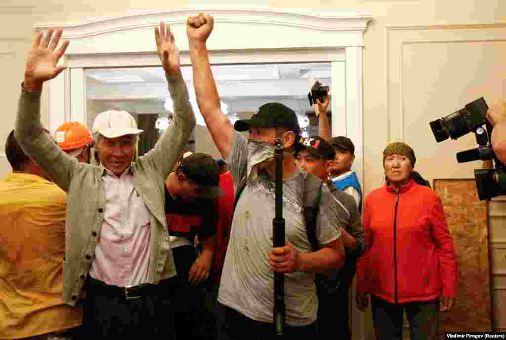 Supporters of Atambaev celebrate after repelling the operation by Kyrgyz special forces. On August 8, the former president announced he would hold a press conference and called on his supporters to join him. 